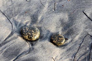 stones-beach-sandy-beach-sand-1702981.jpg