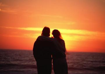 young-happy-couple-at-sunset-beach.jpg