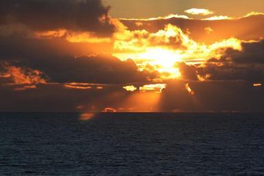 sunset-clouds-sun-sea-water-141069.jpg