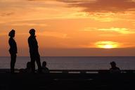 sunset-sea-silhouettes-watching-693435.jpg