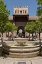 Orange trees courtyard fountain cathedral Puerta del Perdon Seville Spain.jpg