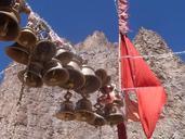 bells-flag-temple-mountains-sky-577311.jpg