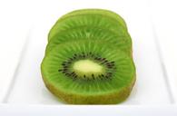 kiwi-sliced-background-bitter-1239244.jpg