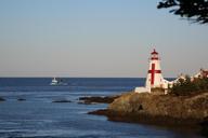 lighthouse-canada-evening-sea-462414.jpg