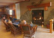 Visitors_by_the_fireplace_at_Old_Faithful_Snow_Lodge.jpg