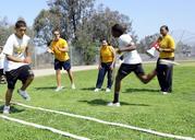 US_Navy_110622-N-CW427-033_Sailors_cheer_students_while_they_complete_an_obstacle_course_during_a_physical_fitness_field_day.jpg