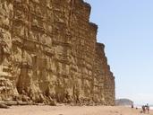 cliffs-beach-sand-coast-rock-surf-959911.jpg