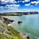 cliffs-beach-skies-coastline-819961.jpg