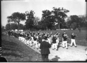 Band_marching_to_Miami-Ohio_Wesleyan_football_game_1921.jpg