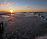 Sunrise over frozen river.jpg