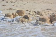 sand-castle-devastation-waves-beach-421508.jpg