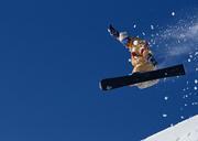 Snowboarder-in-high-mountains-during-sunny-day.jpg