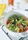 Pot-on-a-stove-with-vegetables-cut-for-making-soup.jpg