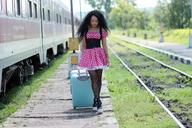 girl-train-station-calling-suitcase-1382023.jpg