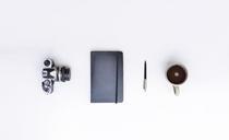 still-life-camera-notebook-pen-cup-601528.jpg