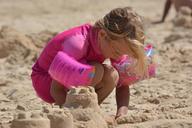 sand-castle-child-girl-pink-sand-436982.jpg