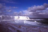 Glacier with snow on the banks of the cold ocean.jpg