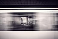 Subway_Train_Moving_Through_Station.jpg