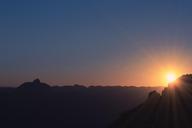 sunset-mountain-range-silhouettes-768772.jpg