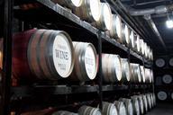 Wine-barrels-stacked-in-the-old-cellar-of-the-winery.jpg