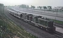 CN_GMD1s_1905_and_1917_with_Train_157_-_160_the_Niagra_Falls_train_approaching_Sunnyside_station,_Toronto,_Ont._on_July_2,_1966.jpg