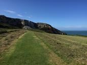 cliffs-blue-sky-grass-coastline-1707699.jpg