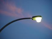 Street light against a streak of pink sunset cloud.jpg