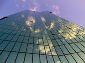 skyscraper-facade-clouds-mirroring-474191.jpg