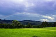 meadow-clouds-rainbow-422941.jpg