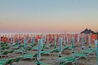 beach-umbrellas-sunset-sea-826955.jpg