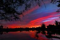 sunset-golf-course-lake-clouds-644476.jpg