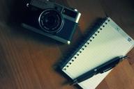 camera-notepad-pen-photography-923429.jpg