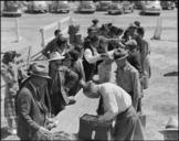 Turlock,_California._Baggage_is_inspected_as_families_arrive_at_Turlock_assembly_center._Evacuees_._._._-_NARA_-_537640.jpg