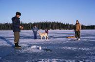 Two adult man with children enjoy skating and ice fishing.jpg