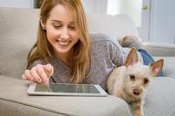 tablet-living-room-dog-woman-girl-843798.jpg