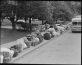 Hayward,_California._Baggage_of_evacuees_of_Japanese_ancestry_stacked_at_public_park_as_evacuation_._._._-_NARA_-_537499.jpg