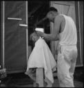 Manzanar_Relocation_Center,_Manzanar,_California._Little_evacuee_of_Japanese_ancestry_gets_a_haircut._-_NARA_-_538083.jpg