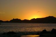 beach-sunset-silhouettes-mountains-696862.jpg