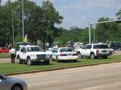 A day without immigrants - Police and media vehicles parked on median.jpg