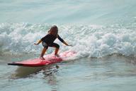 surf-child-mar-beach-water-1138210.jpg