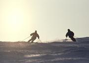 Silhouettes-two-guys-on-skis-on-the-mountain.jpg