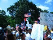 A day without immigrants - protesters, flags, signs.jpg