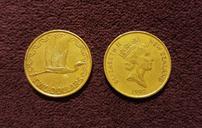 coins-dollars-two-dollar-coin-1466263.jpg