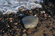 stones-shingle-beach-foam-sand-973178.jpg