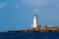 lighthouse-tarifa-atlantic-blue-602858.jpg