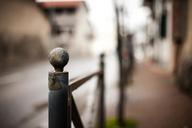 fence-fence-pole-metal-road-street-407259.jpg