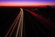 Highway_Sunset,_light_trails,_Poland.jpg