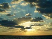 sunrise-rays-sun-clouds-beach-597513.jpg