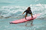 surf-child-beach-sol-mar-water-1138211.jpg