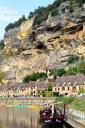 cliff-river-shore-barge-village-890646.jpg